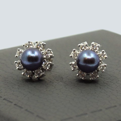 C. Antonsen; Pair of earrings of 18k white gold set with pearl and diamonds C. Antonsen; Pair of earrings of 18k white gold set with pearl and diamonds